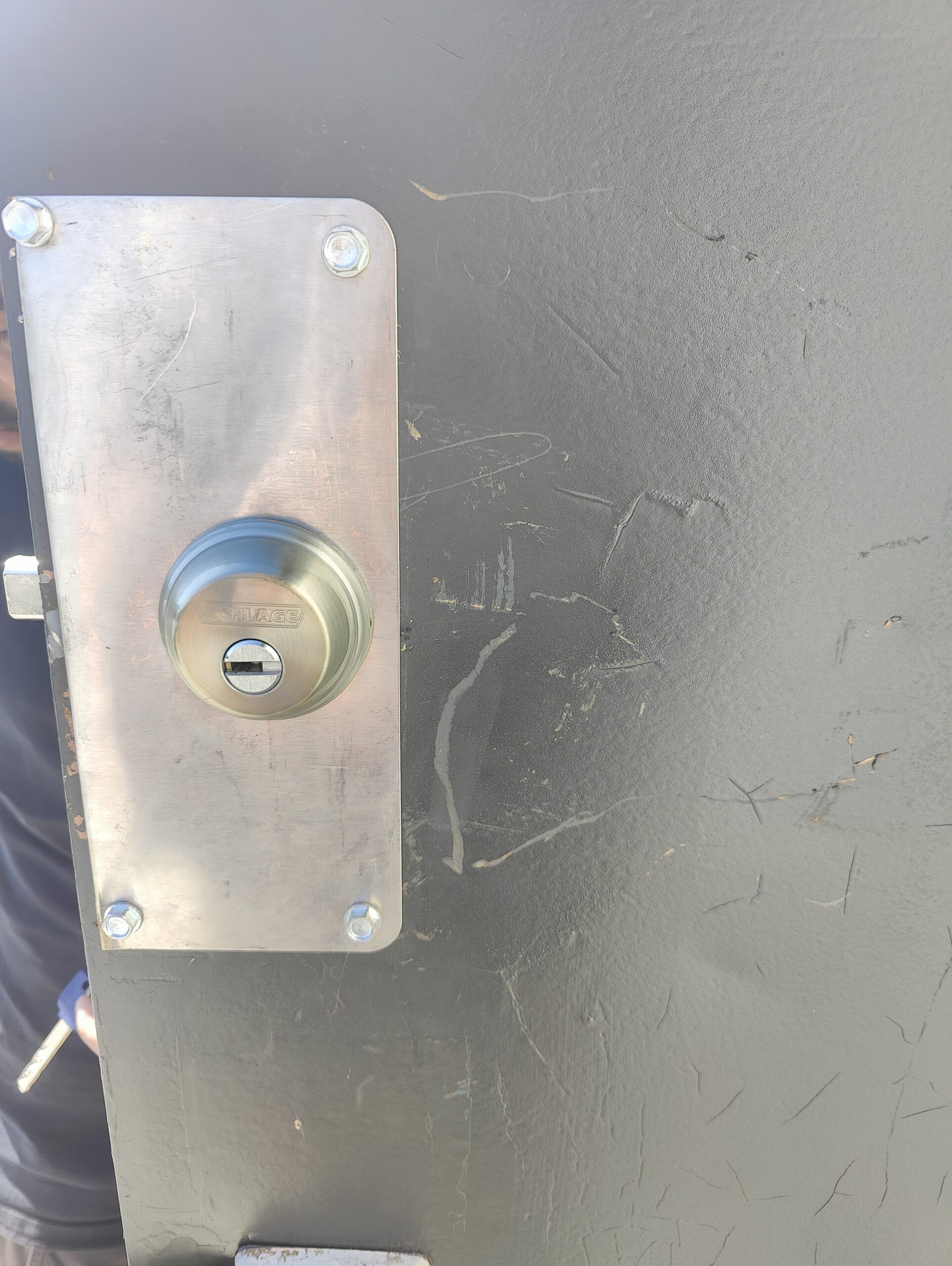 commercial locksmith setting up a new lock